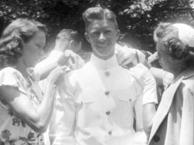 From Left to Right: June 5, 1946 – Rosalynn Smith, Jimmy Carter’s then-fiancée and his mother, Bessie Lillian Gordy – fasten epaulets on Ensign Carter’s uniform at his Naval Academy graduation (Jimmy Carter Library)